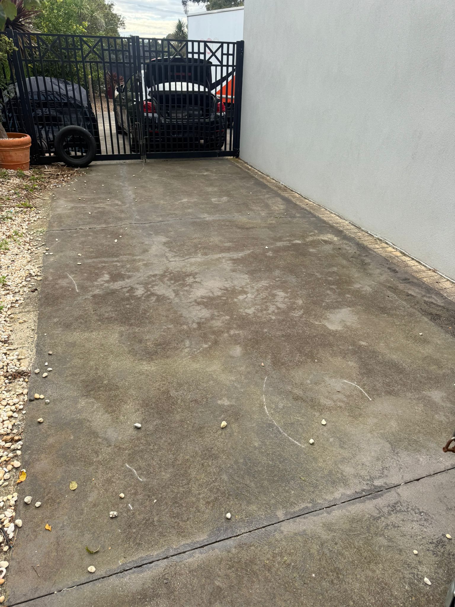 Driveway concrete before pressure washing — dirty stained surface Melbourne